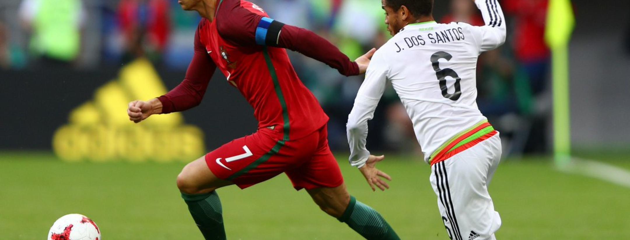 Cristiano Ronaldo takes on Jonathan dos Santos