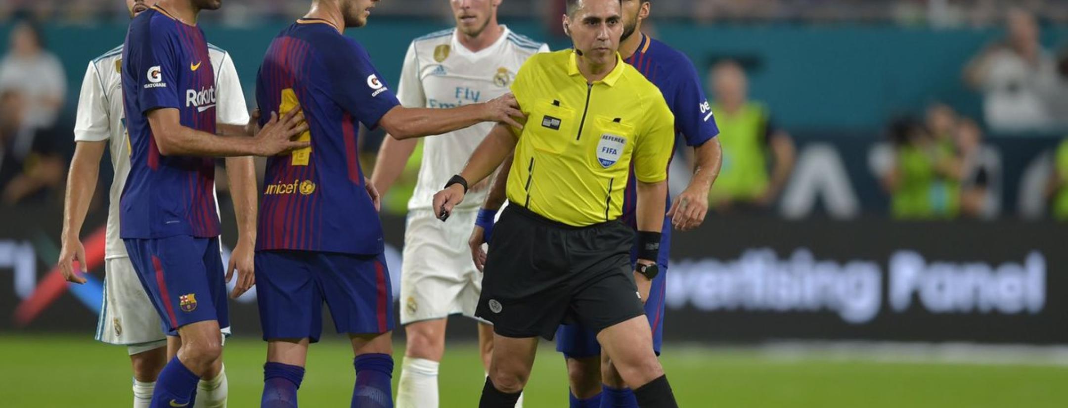 Ivan Rakitic and Jair Marrufo