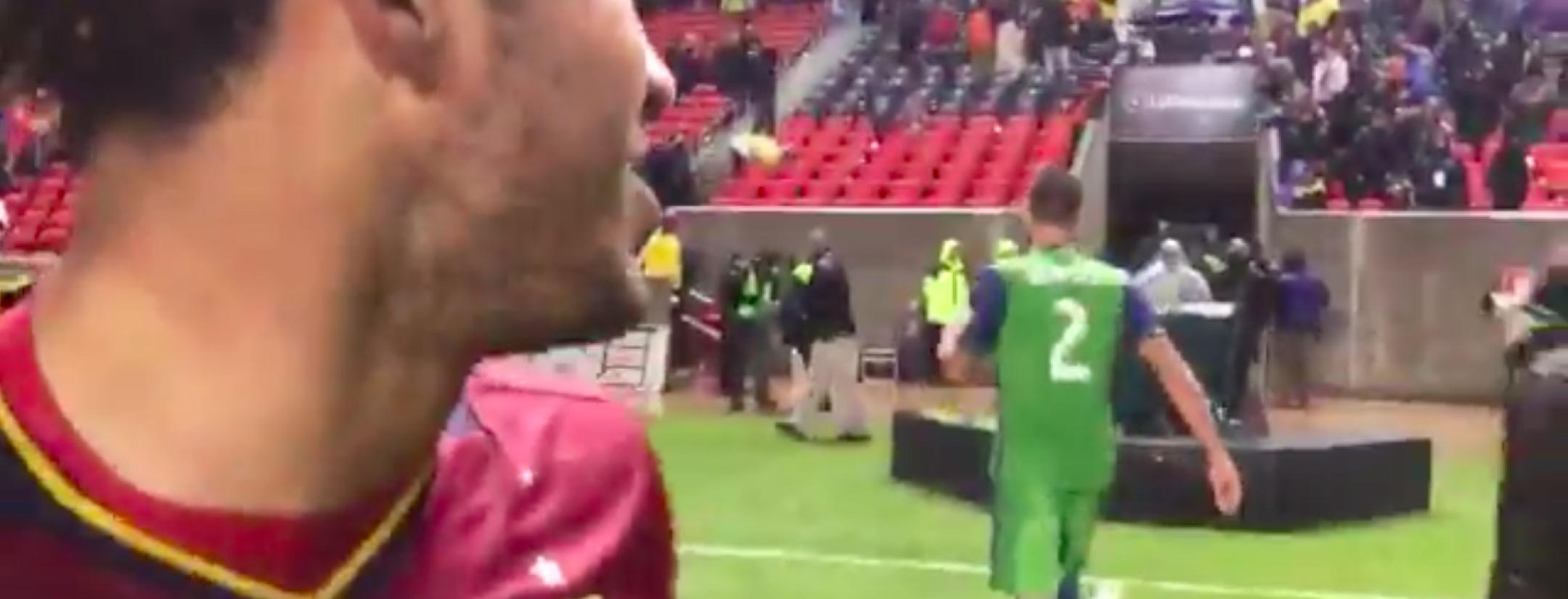 Danilo Acosta and Clint Dempsey exchange words.