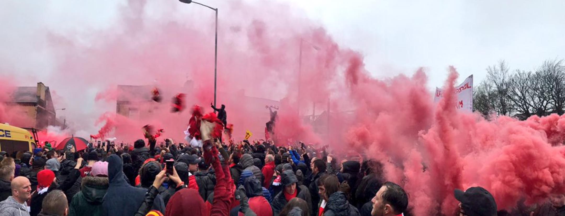 The atmosphere outside Anfield is full of smoke, fire and exactly what you'd expect.