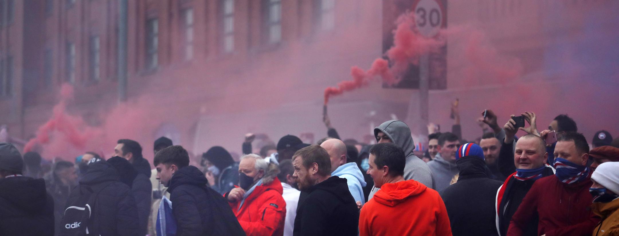 Rangers fans flouted coronavirus lockdown restrictions to gather outside Ibrox before and after their team's 3-0 win over St Mirren to move within a point of the Scottish Premiership title on Saturday.  Goals by Ryan Kent, Alfredo Morelos and Ianis Hagi continued Rangers' 100% home record with a 16th win and they will be champions if Celtic fail to beat Dundee United on Sunday.  Rangers have not won the title since 2011, since when they spiralled into financial turmoil and were demoted to Scotland's bottom 