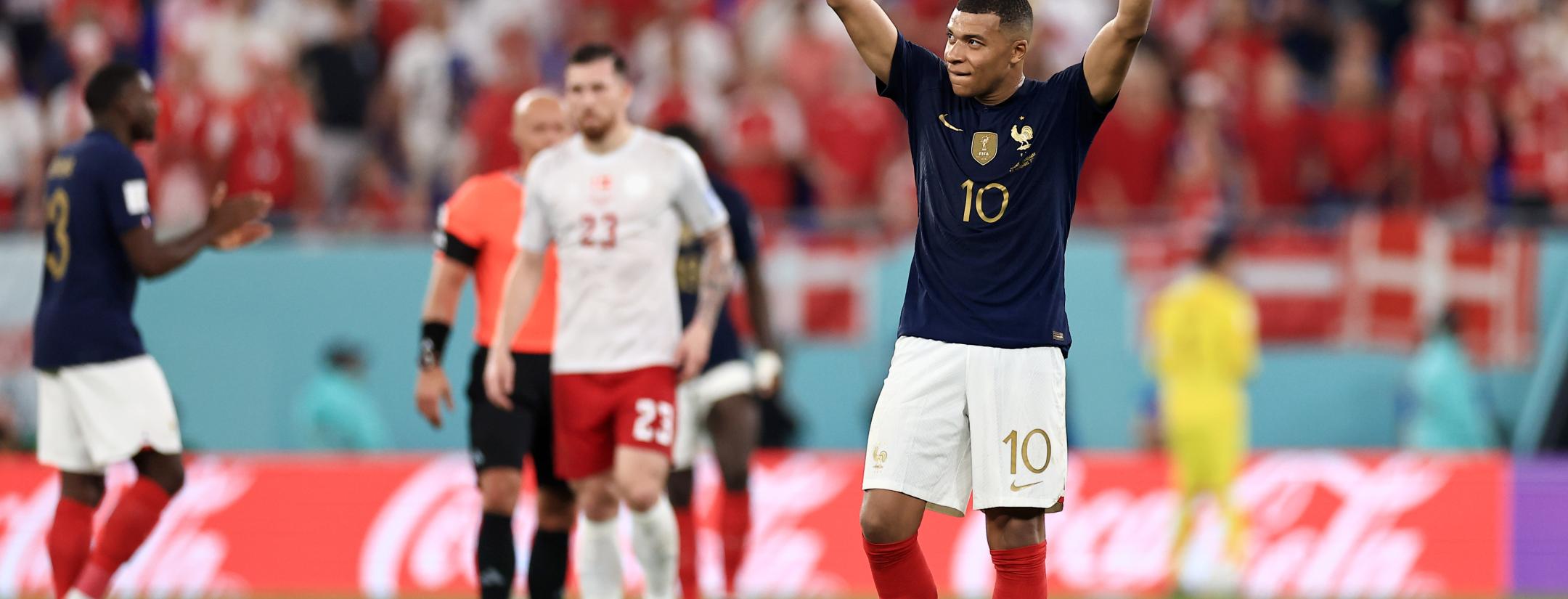 Mbappé double sends France into the knockout round