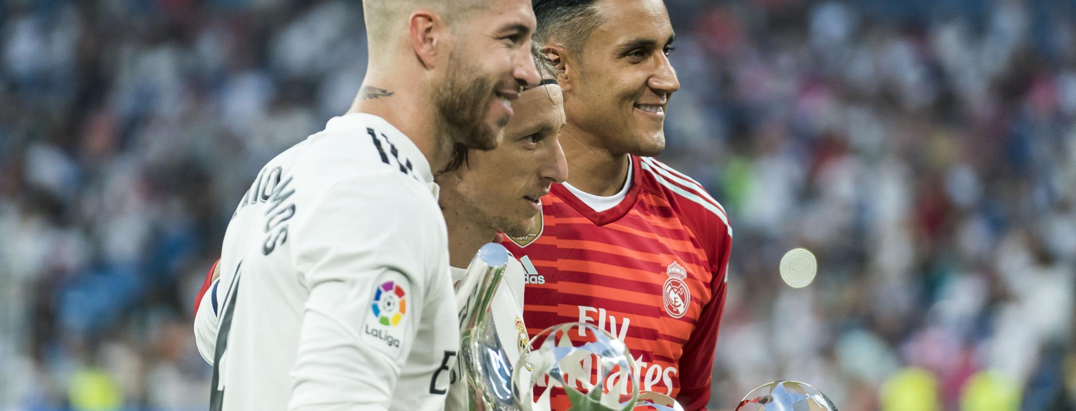Sergio Ramos, Luka Modric and Keylor Navas of Real Madrid pose with their 2017/18 UEFA Men's Defender, Player of the Year and Goalkeeper of the year awards respectively