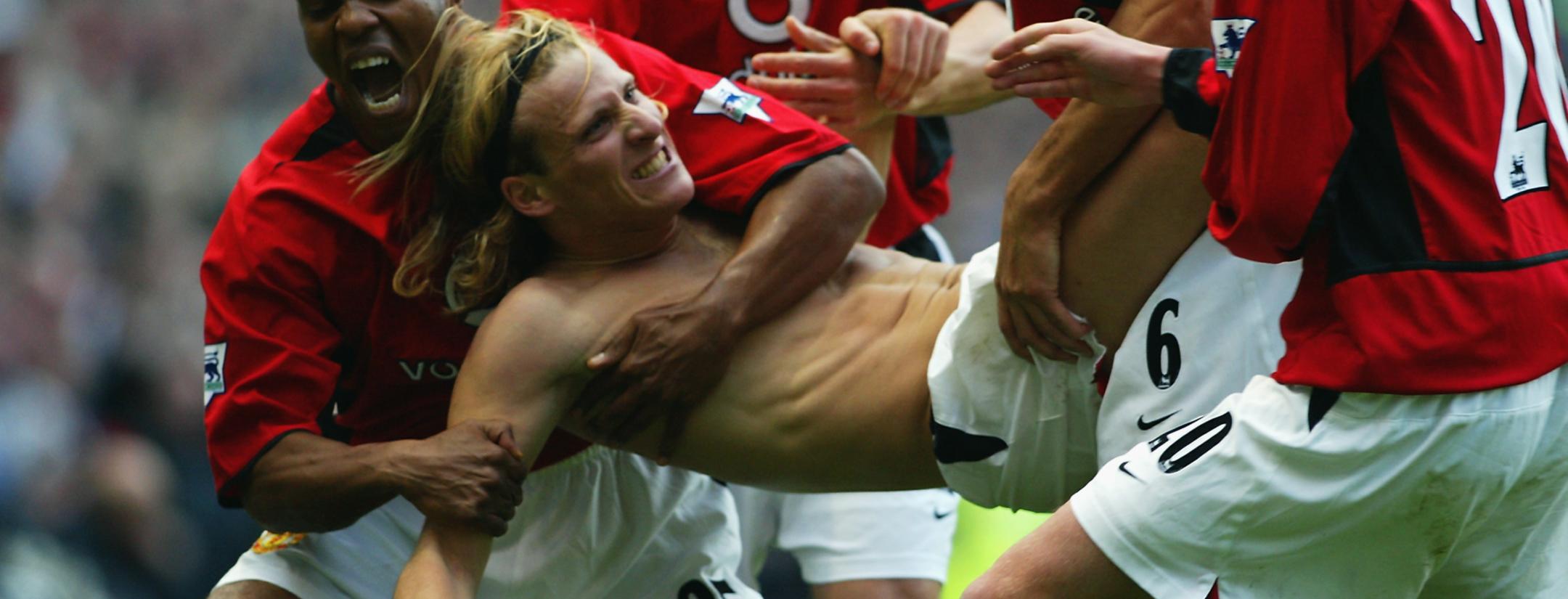 Diego Forlan playing without shirt.