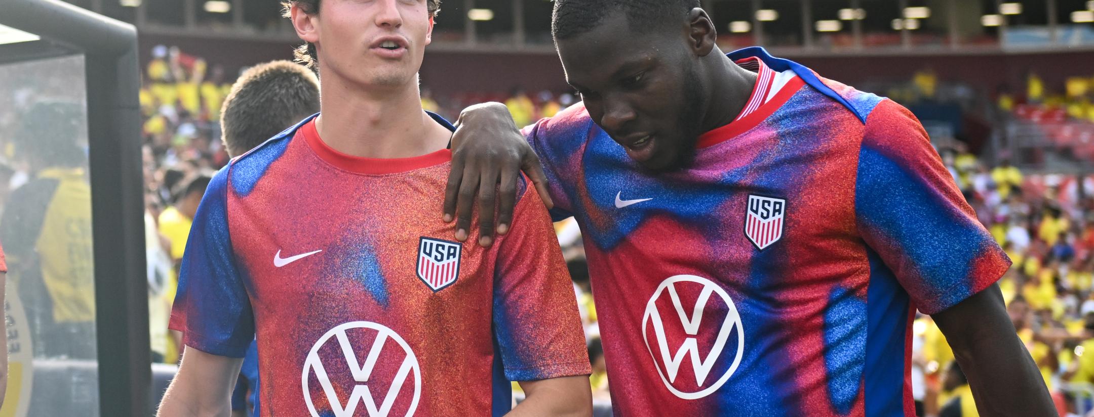 Brenden Aaronson #11 and Yunus Musah #6 of the United States enter the field before the match between Colombia and USMNT at Commanders Field on June 8, 2024 in Landover, Maryland. 