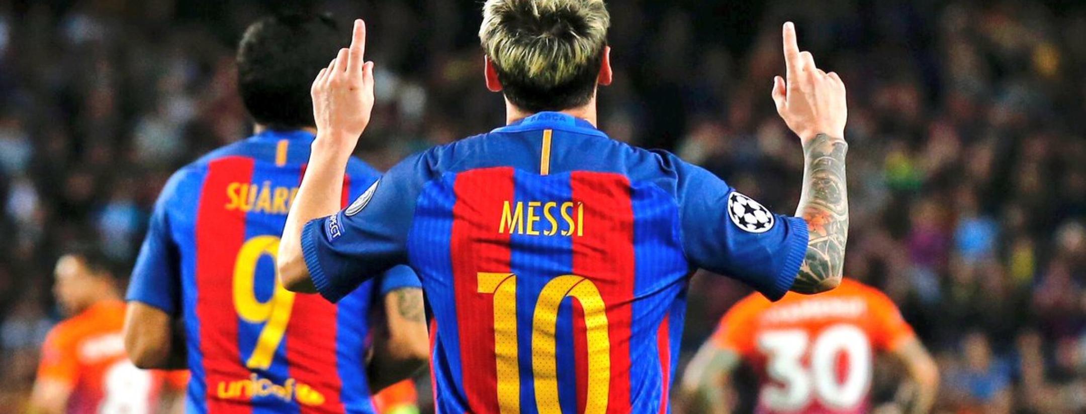 Messi celebrates after scoring the winner against Valencia.