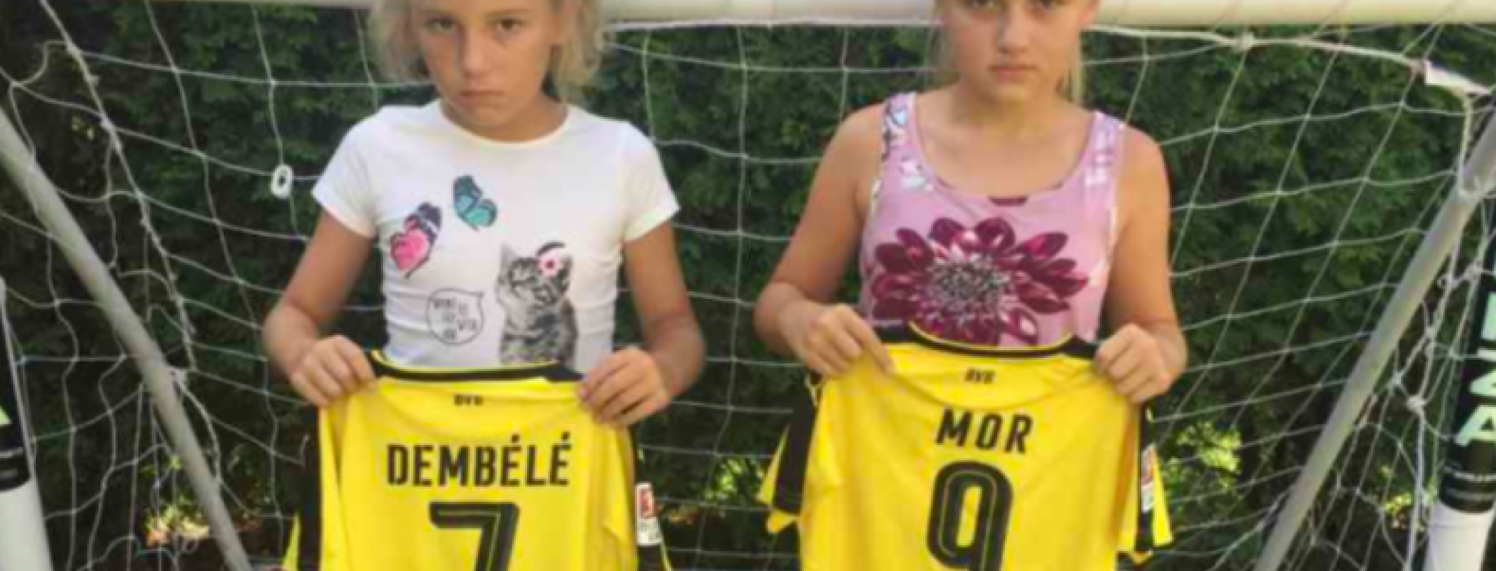 Mario Götze gives jerseys to two young Dortmund fans