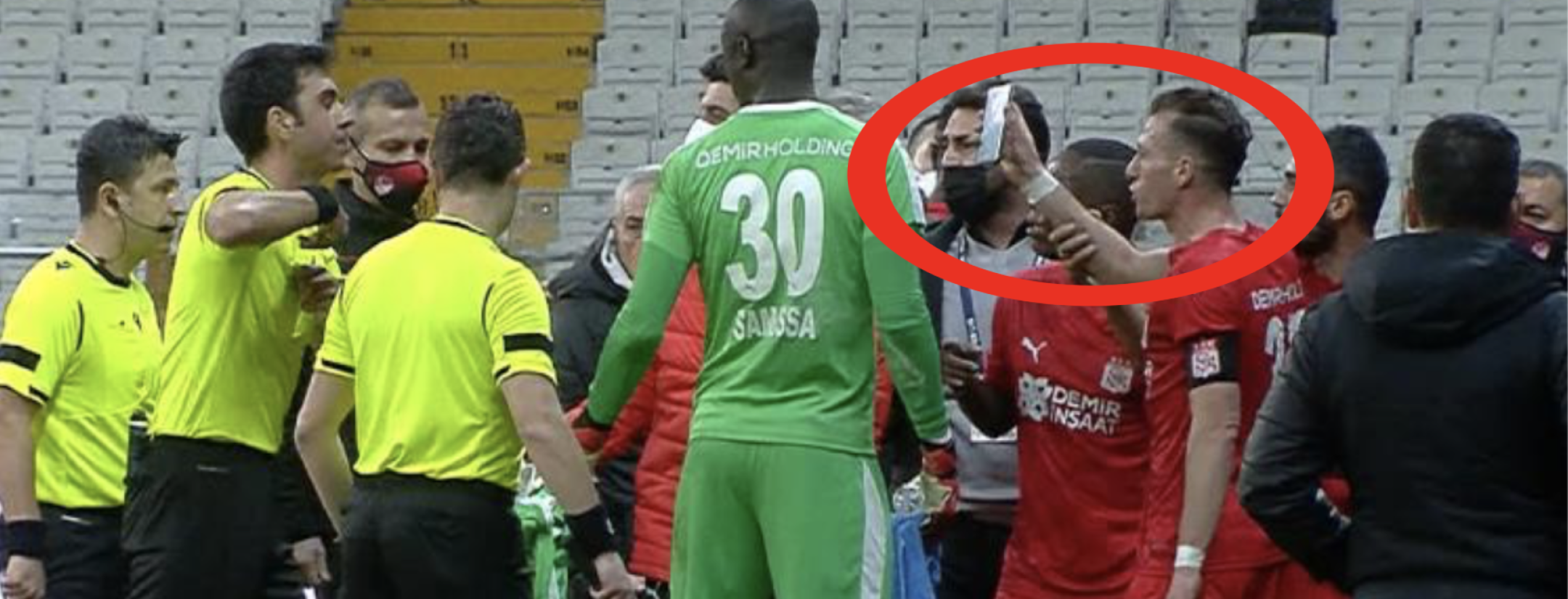 Players pulls out phone