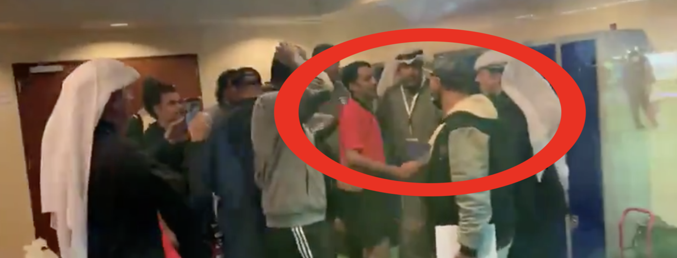 Team celebrates with referee