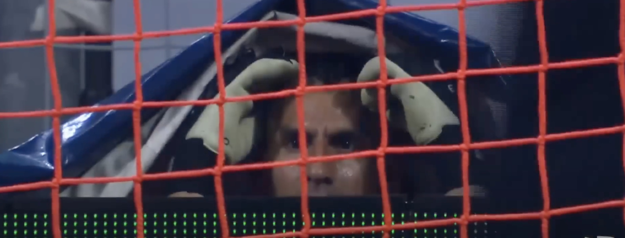 Guzmán hides under tarp after red card