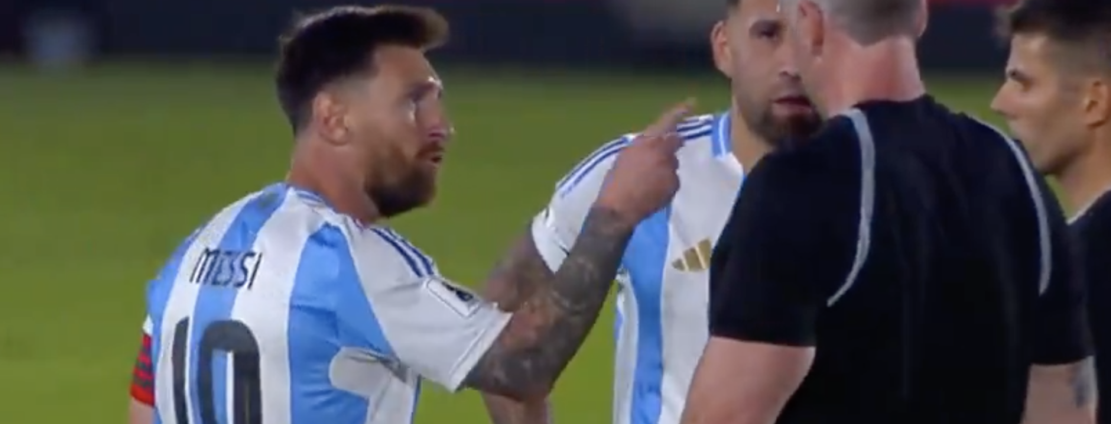 Messi arguing with referees