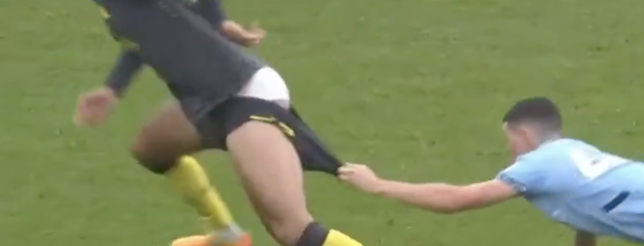 Phil Foden pulling shorts