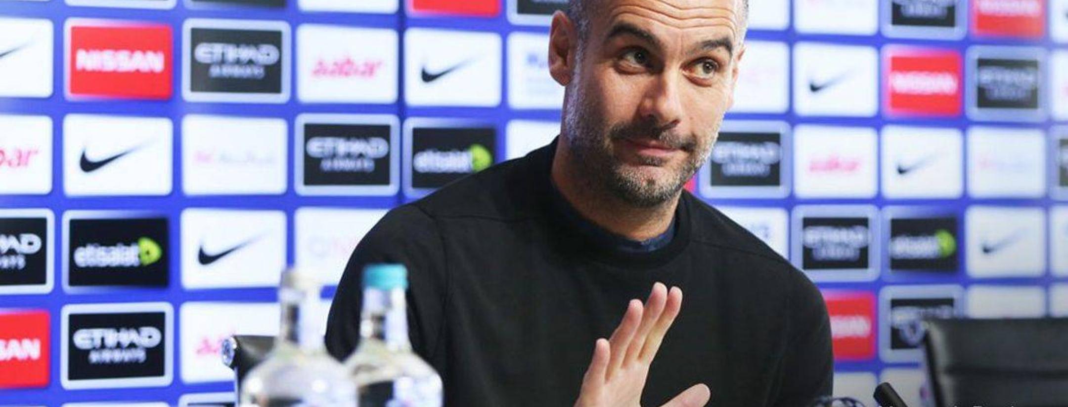 Pep at a press conference.