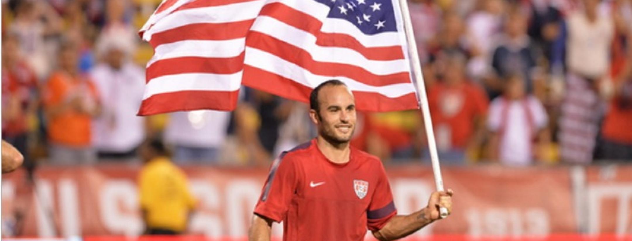 Landon Donovan on the pitch with an American flag