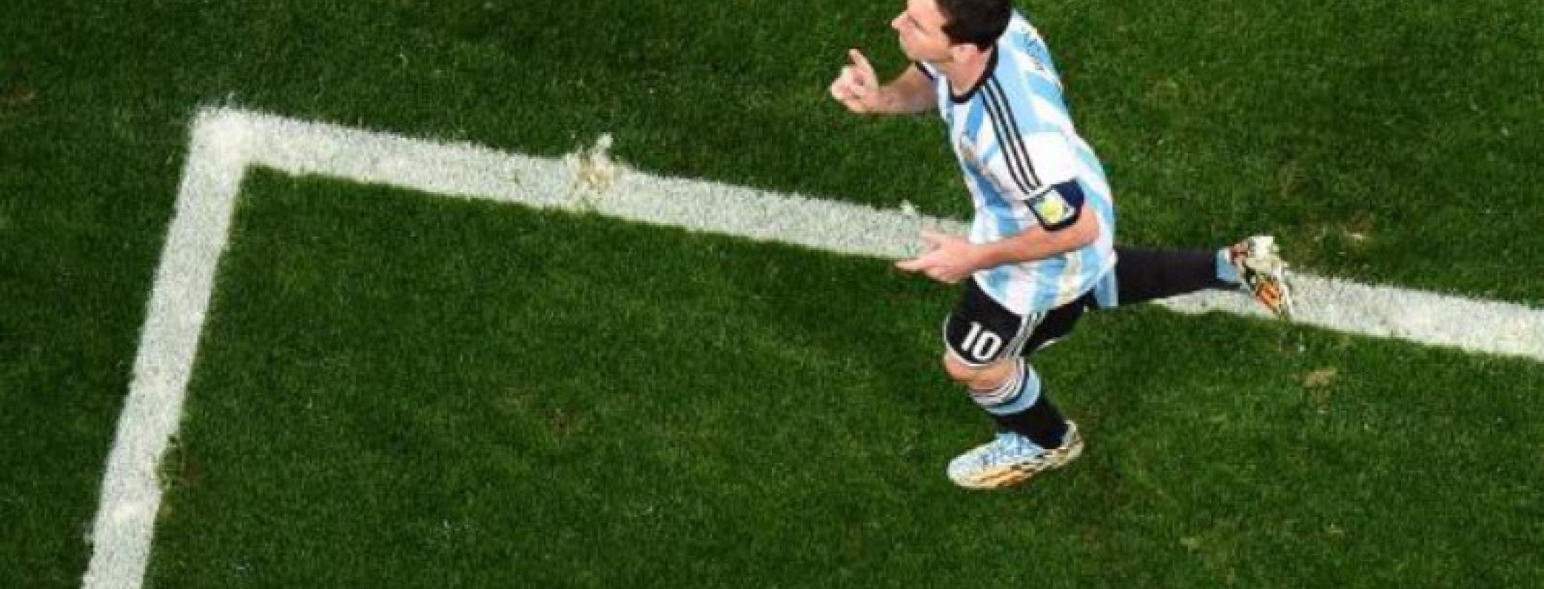 Messi celebrates after scoring Argentina's first penalty