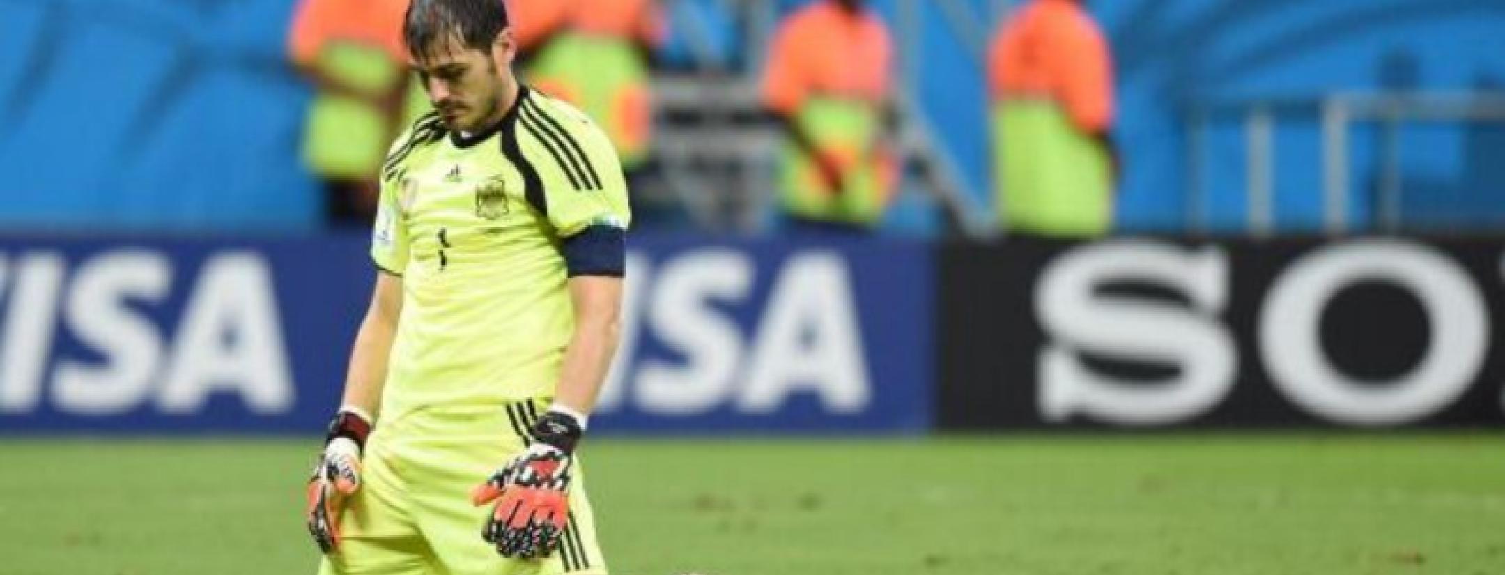 Spain captain Iker Casillas on his knees