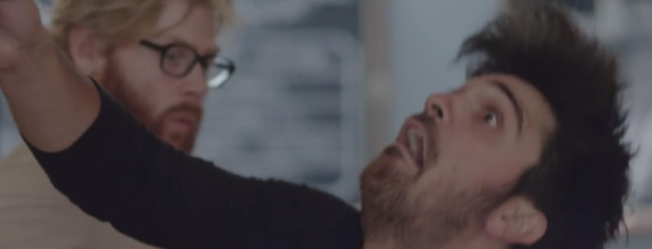 A waiter takes a dive while an innocent patron looks on in horror