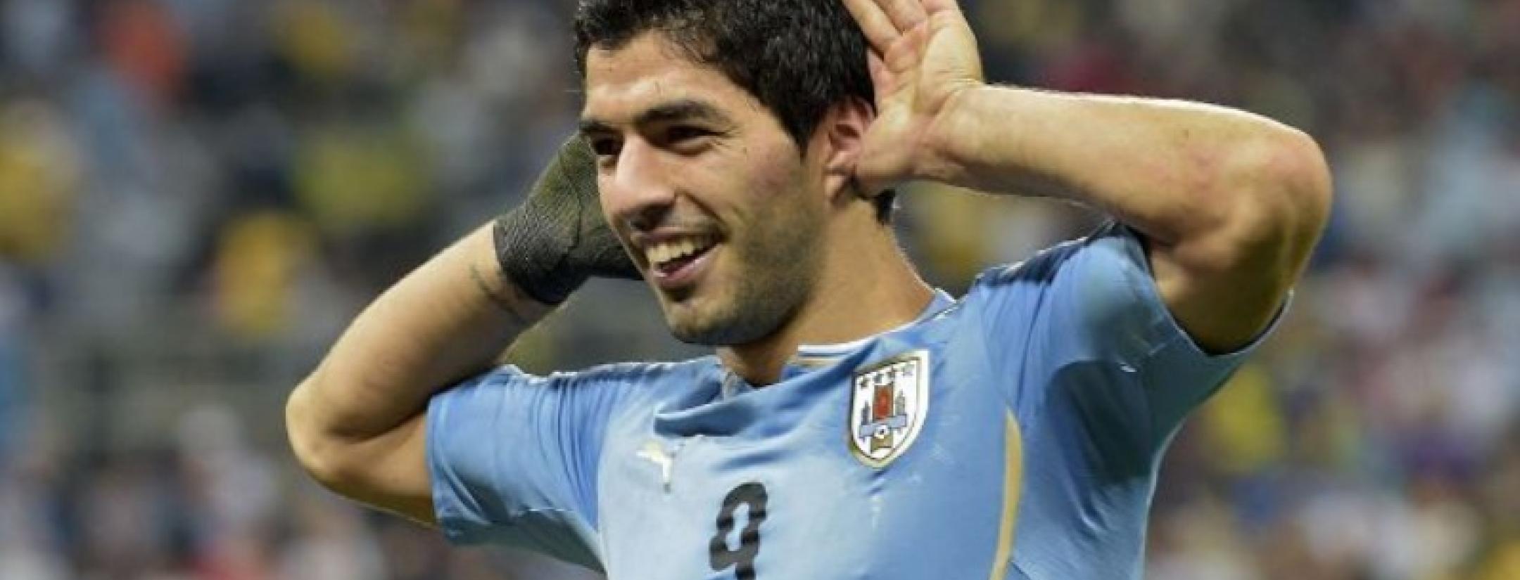 Luis Suarez celebrates his 2 goals in Uruguay's match versus England