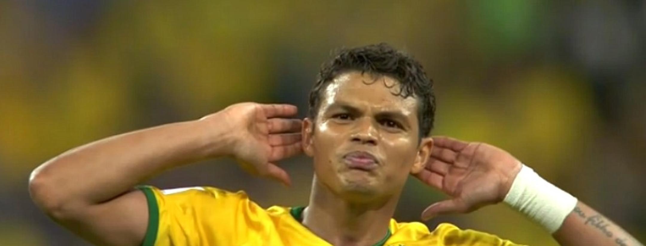 Brazil's Thiago Silva raises his hands to his ears to hear the crowd's roar after Oscar's game-closing goal in the World Cup opener