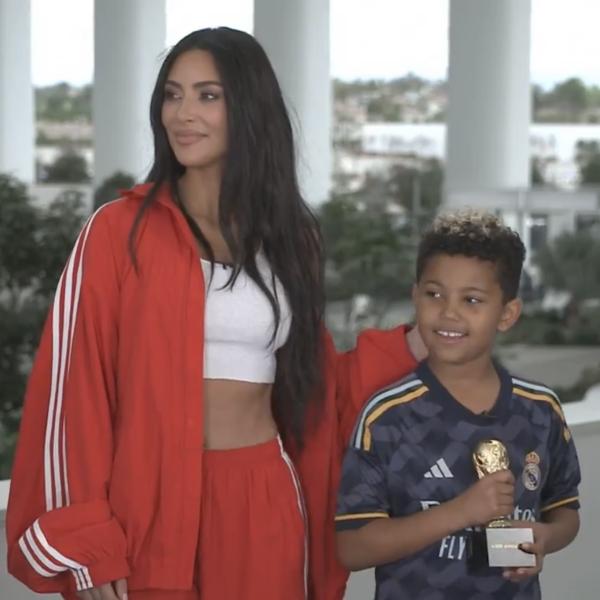 Kim Kardashian standing next to her son Saint West