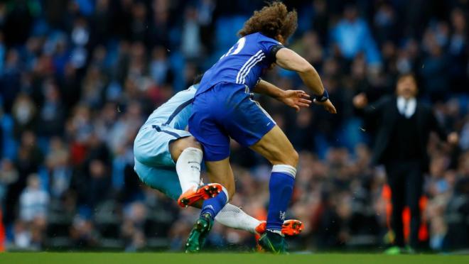 David Luiz responds to Sergio Aguero's tackle.