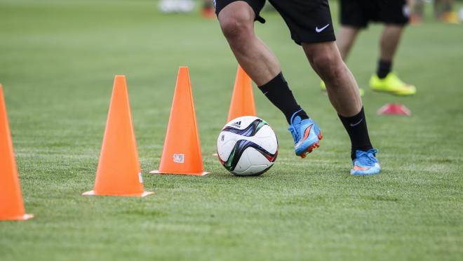 How do soccer players train
