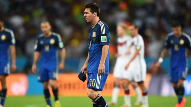 Messi walks off the pitch at the end of regulation time.