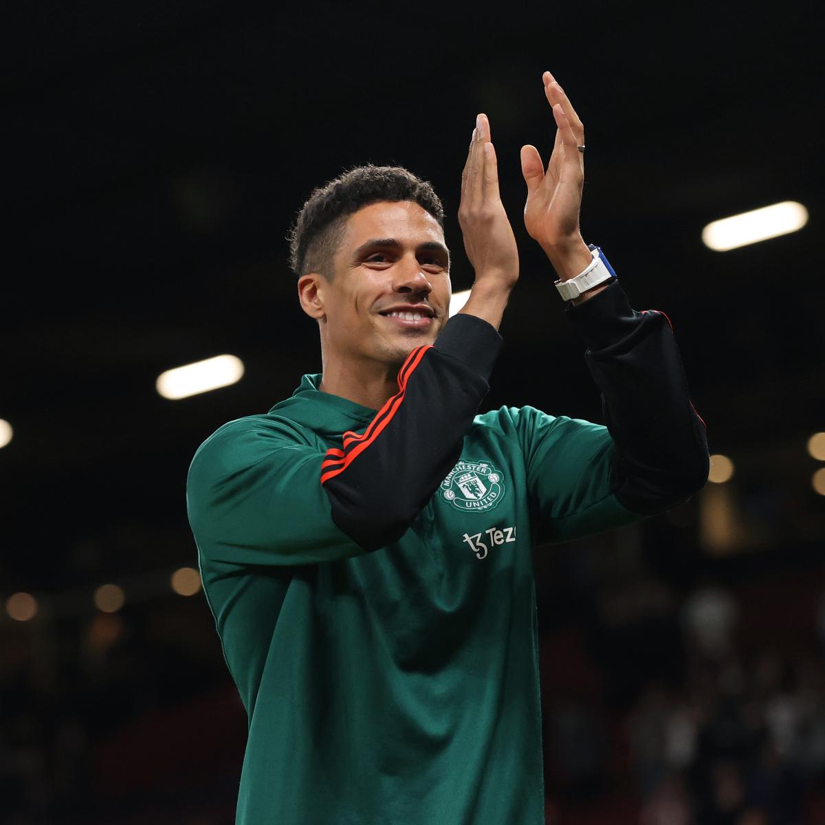Raphaël Varane applauds fans at Old Trafford