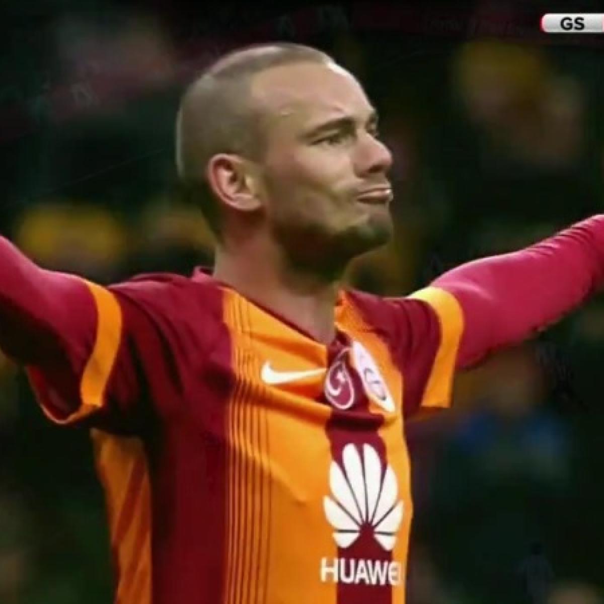Sneijder celebrating, arms raised, with Cantona-esque bravado. 