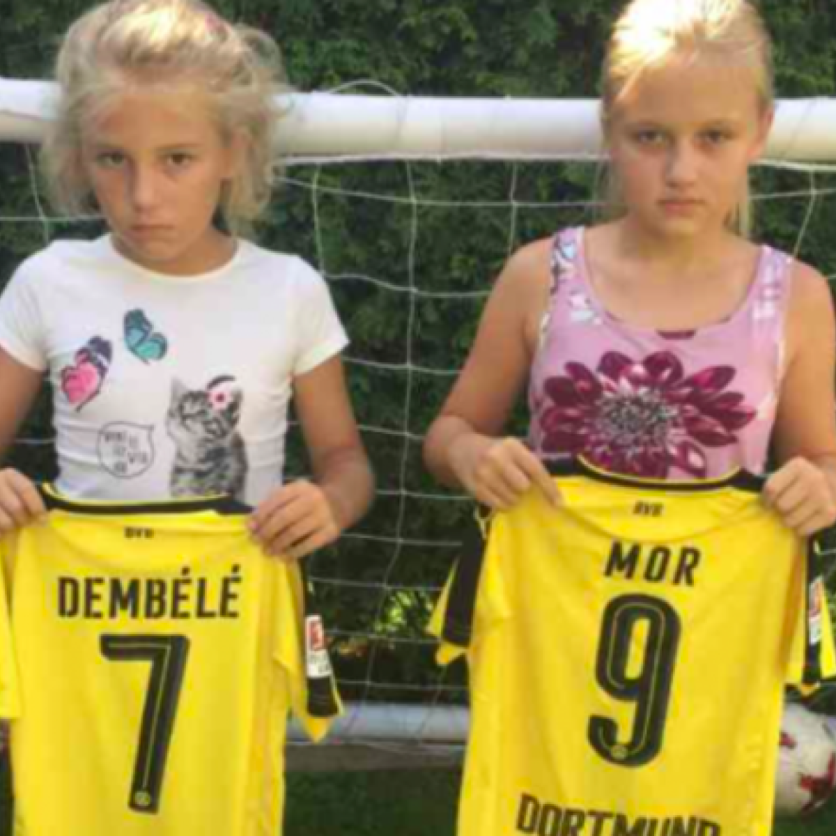 Mario Götze gives jerseys to two young Dortmund fans