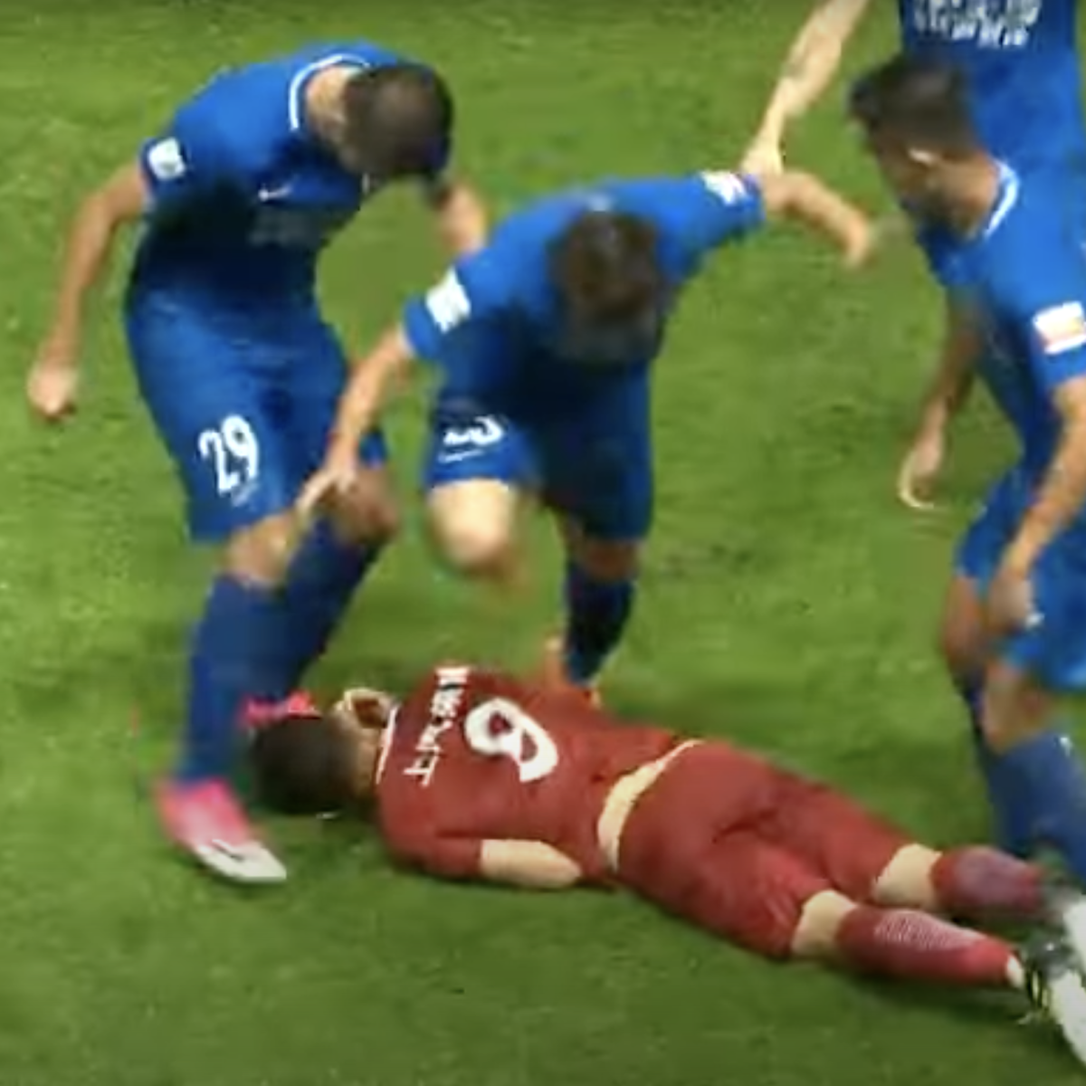 Oscar kicking ball into opponents