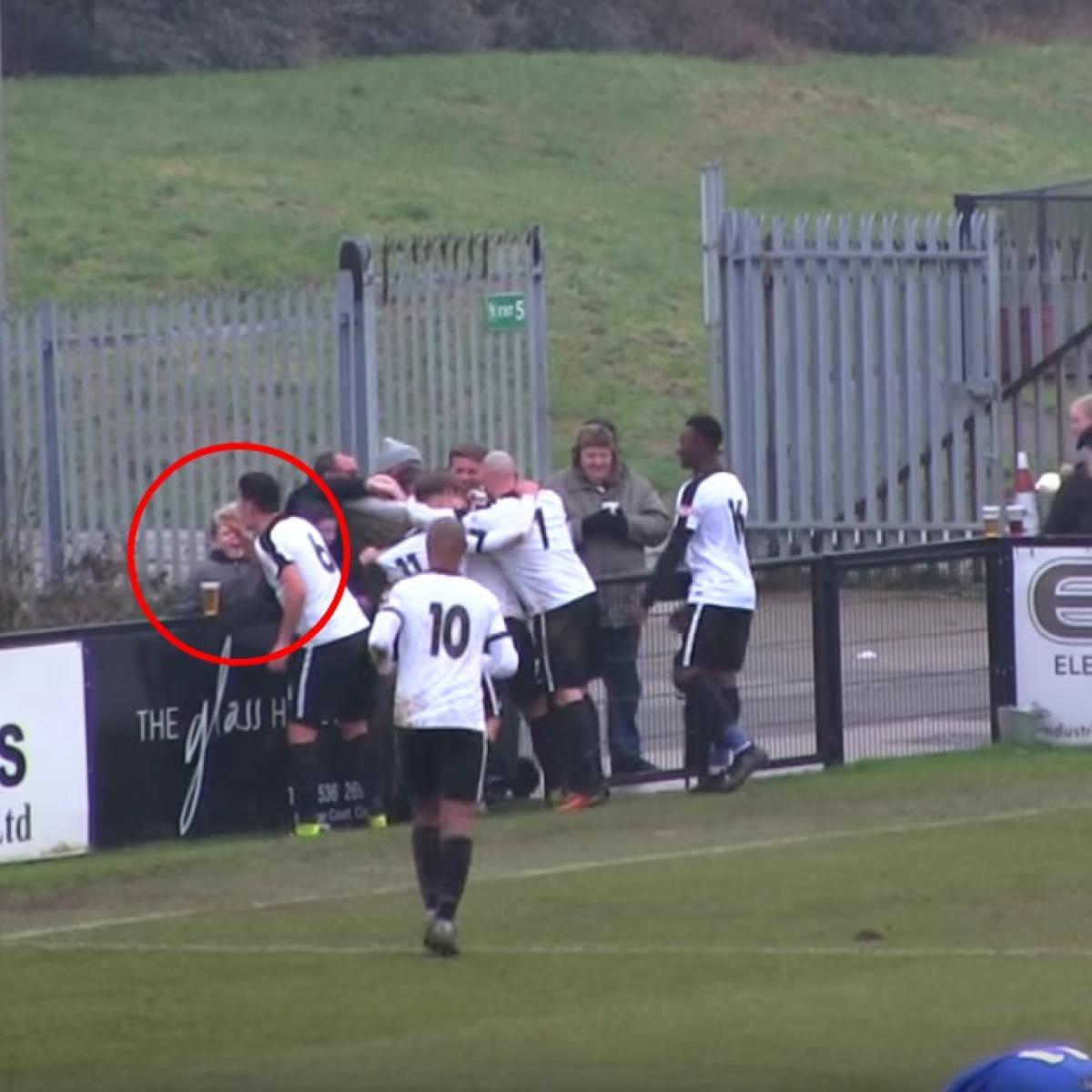 Colby Town player drinks a beer