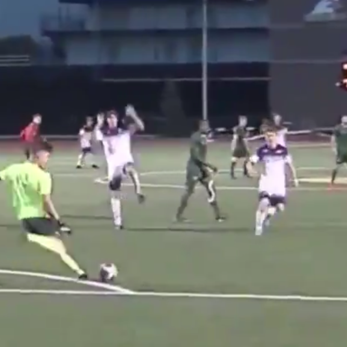 Goalkeeper kicks ball off opponents face 