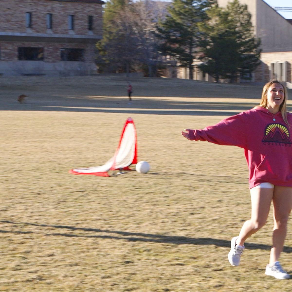 A contestant celebrates a goal.