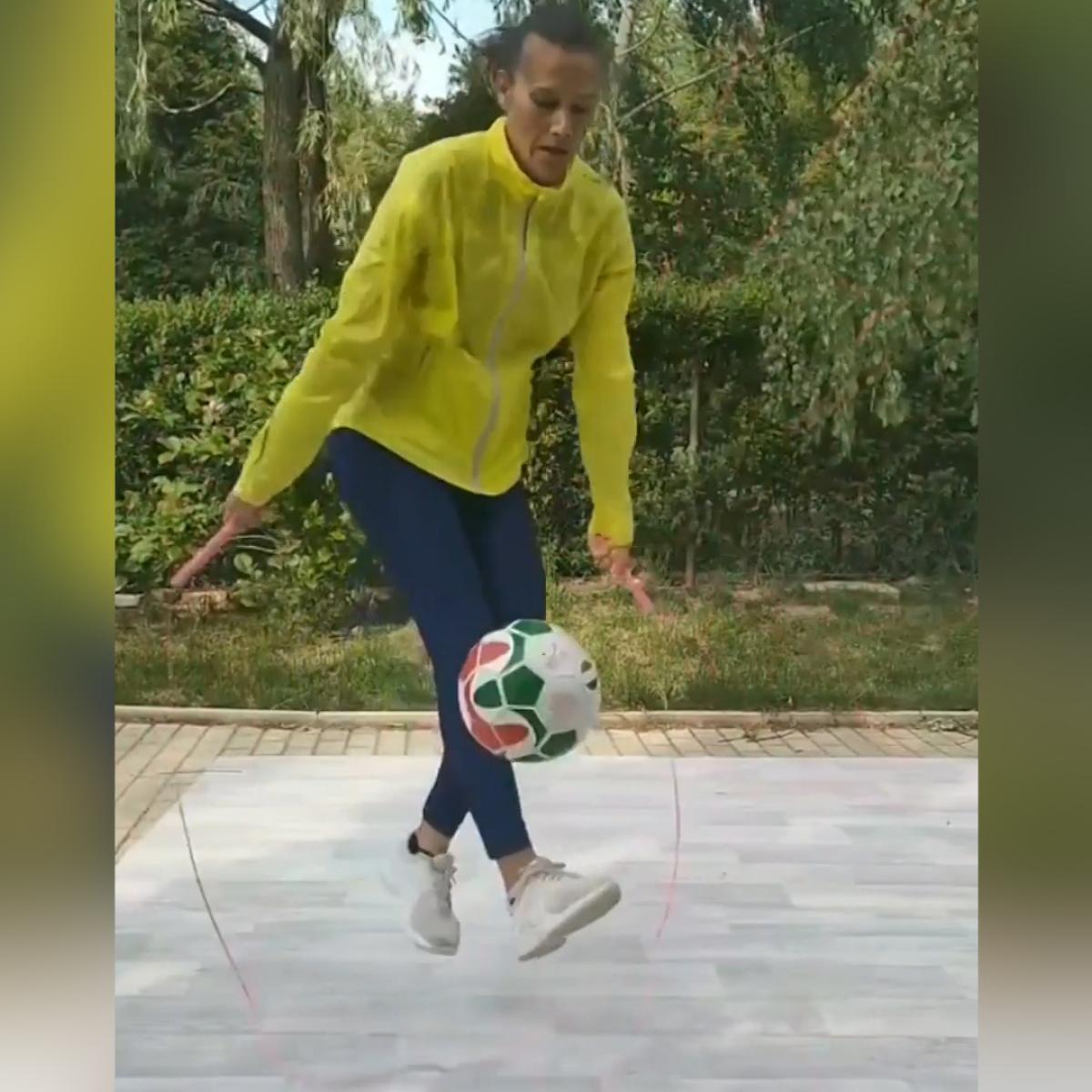 Woman jumping rope while juggling