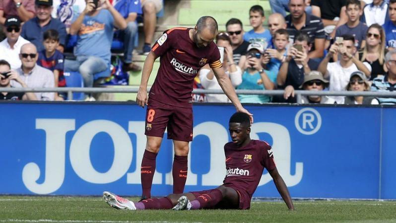 Ousmane Dembele and Andres Iniesta