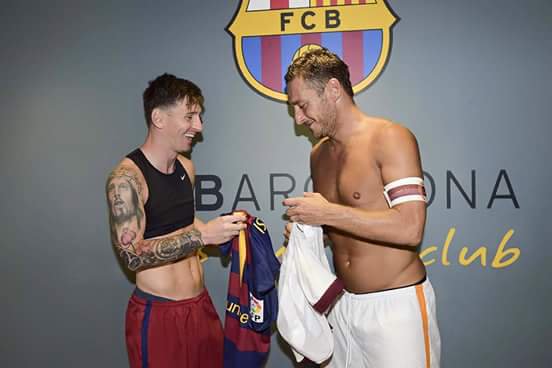 Lionel Messi and Francesco Totti