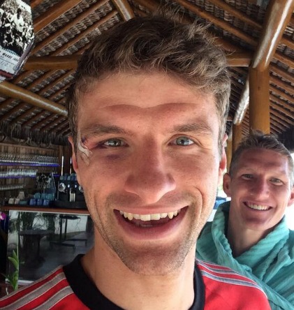 Muller shows off his cut