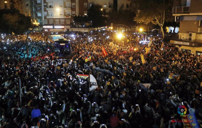 Valencia fans as the team bus arrives outside the stadium