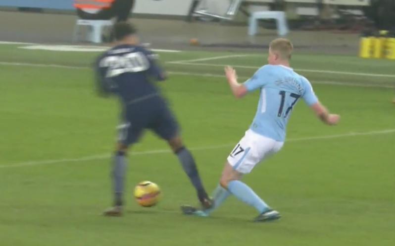 Kevin De Bruyne takes a stomp on the ankle from Dele Alli