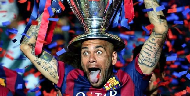 dani alves with a trophy