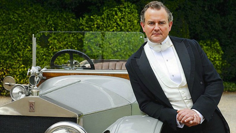 Some pretentious prick is pictured leaning on a car. Presumably he is from the show Downton Abby. 